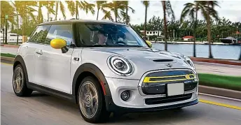 ??  ?? Plug in: The new zero-emissions British-built MINI Electric being tested in Miami