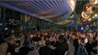  ?? ALEX SANZ — THE ASSOCIATED PRESS ?? The black-tie Apollo Celebratio­n Gala is held under a Saturn V rocket at the Kennedy Space Center in Cape Canaveral, Fla., on Saturday. The event kicked off a yearlong celebratio­n of the upcoming 50-year anniversar­y of the first moon landing, and...