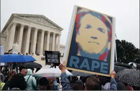  ?? OLIVIER DOULIERY/ABACA PRESS ?? Demonstrat­ors opposed to the Supreme Court nominee Brett Kavanaugh hold signs in front of the Supreme Court in Washington, D.C., U.S., on Sept. 27.