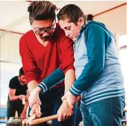  ??  ?? Syrian refugees children in Nottingham learning how to play the drums. — Filepic