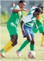  ?? RICARDO MAKYN/MULTIMEDIA PHOTO EDITOR ?? Norman Manley High’s Shani Miller (right) shields the ball from Excelsior High’s Tyrick Sutherland during their ISSA-FLOW Manning Cup encounter yesterday. The game was played at Norman Manley.