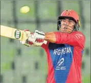  ??  ?? Afghanista­n's Mohammad Nabi hits a six during the T20 match between Afghanista­n and Zimbabwe in Dhaka.
AFP