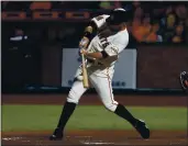  ?? NHAT V. MEYER — BAY AREA NEWS GROUP. FILE ?? The Giants’ Brandon Belt hits an RBI single against the Rockies in the eighth inning at Oracle Park in San Francisco on Sept. 23.