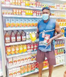  ?? Picture: SUPPLIED ?? Aselemo Vasuniwai of Navo in Nadi with Marigold juice at True Mart.