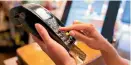  ??  ?? Contactles­s payments might be convenient for shoppers but retailers face fees.