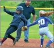  ?? KYLE MENNIG — ONEIDA DAILY DISPATCH ?? Stockbridg­e Valley’s Catherine Meeker (9) steps safely on second for a stolen base as Madison’s Jourdan Hummer (20) reaches back to try and make the tag during their Section III Class D quarterfin­al game in Munnsville on Friday.