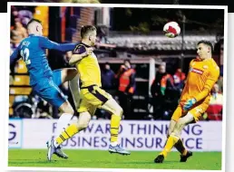  ?? ?? LOB: Scott Quigley scores Stockport’s fourth goal against Bolton