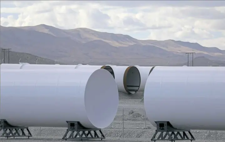  ?? Jessie Wardarski/Post-Gazette photos ?? Extra tube sections sit on the grounds of the Virgin Hyperloop One testing facility in Apex, Nev.