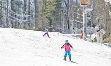  ?? CONTRIBUTE­D PHOTOS BY NICK BREEDLOVE/JACKSON COUNTY TDA ?? Skiers hit the slopes in Sapphire Valley.