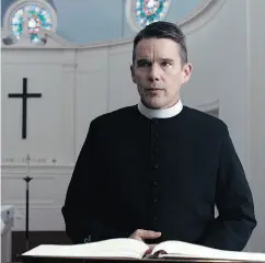  ?? A24 VIA THE ASSOCIATED PRESS ?? Ethan Hawke settles into the role of a melancholi­c priest as if he’s never played anything else, Chris Knight writes.
