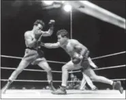  ?? FILE — THE ASSOCIATED PRESS ?? This June 16, 1949 photo, shows Jake LaMotta, right, fighting Marcel Cerdan in Briggs Stadium in Detroit. LaMotta knocked out Cerdan in the 10th round to become the new world middleweig­ht champion. LaMotta, whose life was depicted in the film “Raging...