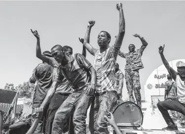  ?? Associated Press ?? Sudanese celebrate Thursday in Khartoum after officials said the military had forced autocratic President Omar al-Bashir to step down after 30 years in power. Peaceful demonstrat­ions preceded Bashir’s ouster.