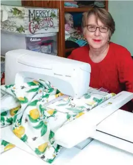  ?? COURTESY OF BETH DAVISSON ?? Beth Davisson sits in the sewing room of her Bakersfiel­d home, while she takes a break from her Christmas gift-making.