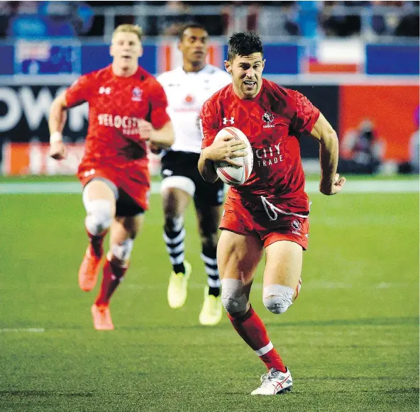  ?? — GETTY IMAGES FILES ?? Abbotsford’s Justin Douglas scores a try for Canada during a match against Fiji last weekend at the World Rugby Sevens Series tournament in Las Vegas. Douglas has scored 19 tries this season, putting him fourth in the HSBC World Rugby Sevens Series.