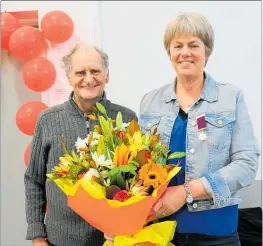  ??  ?? Trevor Beale, the fire chief for the Herbertvil­le Rural Fire Force, with deputy chief Sue Barnett, who was awarded her 25 year gold star at the Herbertvil­le Fire Station last Thursday night. The evening was also a farewell for Sue who is leaving the district.