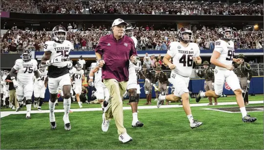  ?? | Washington Post SMILEY N. POOL/THE DALLAS MORNING NEWS/TNS ?? Texas A&M’s Jimbo Fisher is the highest-profile coach to be dismissed — so far. Fisher, lured away from Florida State after winning a national championsh­ip, went 45-25 with the Aggies but never contended for an SEC title. The school will pay him a record $76 million buyout, even if he lands another job.