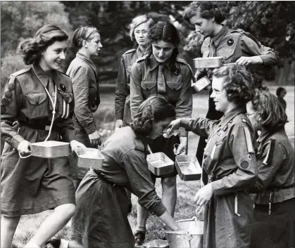  ??  ?? TRADITION: Princess Margaret, left, at a Guides camp in 1944 – a stark contrast to its modern, and very PC, image