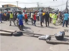  ??  ?? #ENDSARS protest group blocked all sides of Okota Roundabout in Lagos, yesterday, causing serious gridlock in the area. Pic by Pius Okeosisi