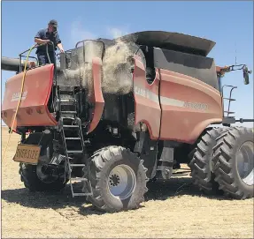  ??  ?? MAINTENANC­E: Removing flammable material from the engine bay is important in preventing harvester fires. Picture: BEN WHITE