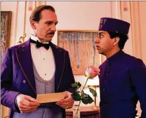  ?? FOX SEARCHLIGH­T PICTURES/TNS ?? Ralph Fiennes (left, with Tony Revolori) plays a deadpan concierge who keeps things running smoothly at “The Grand Budapest Hotel” until he’s caught up in an unusual caper.