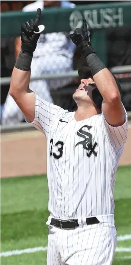  ?? GETTY IMAGES ?? Sox catcher James McCann points skyward after hitting a home run in the sixth inning against the Twins. The Sox hit five homers Saturday.