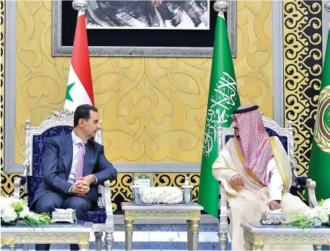  ?? Reuters ?? Syria’s President Bashar Al Assad and Prince Badr bin Sultan, Makkah deputy governor, before the Arab League Summit in Jeddah