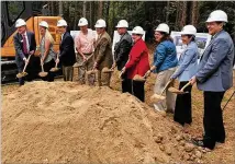  ?? TYLER ESTEP / TYLER.ESTEP@AJC.COM ?? Gwinnett County officials break ground Tuesday in a ceremony at the future site of county’s water innovation center, which will be built in between I-985 and I-85 near Buford. The project is expected to take about three years.