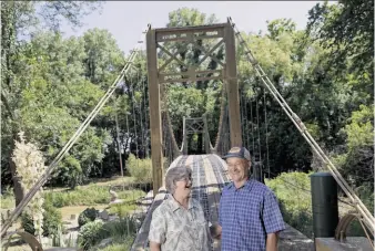  ?? Steve Hebert / Special to The Chronicle ?? Larry and Barbara Richardson have a 150-foot-long replica of the Golden Gate Bridge in Mulvane, Kan., which he built with his dad, starting in 1994 and finishing in 2001.