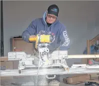  ?? CP PHOTO ?? A man works on a new home in a subdivisio­n earlier this month near Charlottet­own.