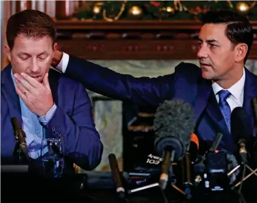  ?? REUTERS ?? Emotional: Andy Woodward (right) consoles Steve Walters at the launch of Offside Trust