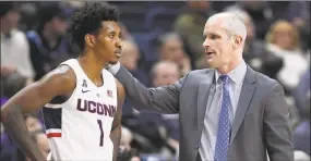  ?? Jessica Hill / Associated Press ?? UConn coach Dan Hurley, right, and Christian Vital during a January game in Storrs.