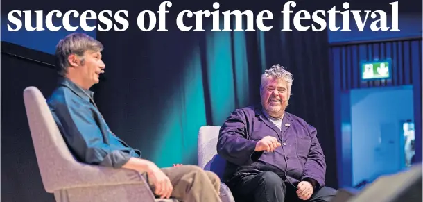  ??  ?? INFORMAL CHAT: Crime author Ian Rankin and comedian Phill Jupitus enjoy a discussion in front of an Aberdeen Music Hall audience as part of the Granite Noir festival