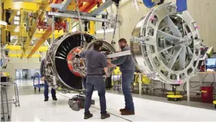  ?? — Reuters ?? Technician­s build LEAP engines for jetliners at General Electric factory in Lafayette, Mississipp­i.