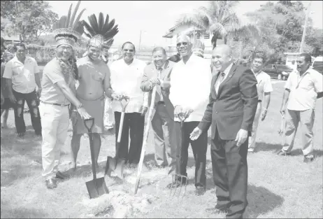  ?? (Keno George photo) ?? The Chairman and Vice-Chairman of the National Toshaos Council (NTC) with President David Granger (with fork) and government ministers at the turning of the sod for the NTC Secretaria­t at the Sophia Exhibition Centre. In picture (from left) are NTC Chairman Joel Fredericks, NTC Vice-Chairman Lennox Shuman, Prime Minister Moses Nagamootoo, Minister of Indigenous Peoples’ Affairs Sydney Allicock, President Granger and Minister of Social Cohesion Dr George Norton.