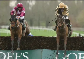  ??  ?? Rob James and Ruby Walsh neck and neck after jumping the last in Gowran Park on Thursday.