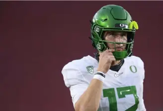  ?? Harry How/Getty Images ?? Oregon quarterbac­k Tyler Shough led the Ducks to the Pac-12 title on Friday.