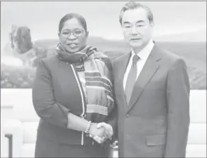  ??  ?? Suriname’s Foreign Minister Yldiz Pollack-Beighle (left) greets China’s Foreign Minister Wang Yi at the meeting. (Caricom photo)