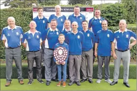  ??  ?? The winning squad with mascot Ryan Johnston holding the shield.