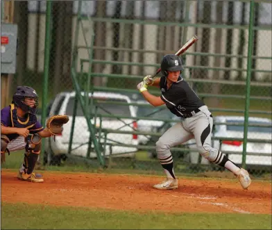  ?? Terrance Armstard/News-Times ?? Concentrat­ion: Smackover's Cade Schibler waits on a pitch during the Bucks' game at Junction City during the 2017 season. Schibler is one of several starters who are working in tandem with Smackover's younger players on the Bucks' American Legion...