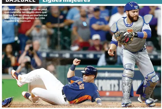  ?? PHOTOYAFP ?? Le receveur Russell Martin ne peut que constater les dégâts alors que Carlos Beltran glisse au marbre sur le triple d’alex Bregman, qui crée l’égalité 6-6.