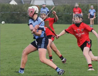  ??  ?? Andrew Moran of St. Anne’s about to strike the ball away from Michael O’Brien (Oulart-The Ballagh).