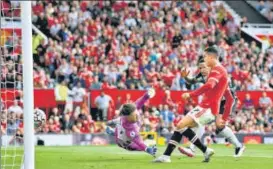  ?? GETTY ?? Cristiano Ronaldo scores Man United’s first goal against Newcastle at Old Trafford on Saturday.