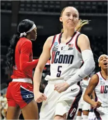  ?? AP PHOTO/JESSICA HILL ?? Connecticu­t guard Paige Bueckers flexes after making a basket while getting fouled during an NCAA tournament second-round game against Jackson State on Saturday in Storrs, Conn.