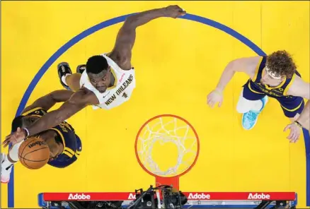  ?? ?? Golden State Warriors forward Draymond Green, left, and New Orleans Pelicans forward Zion Williamson (1) compete for a rebound during the first half of an NBA basketball game Friday, April 12, 2024, in San Francisco. (AP)