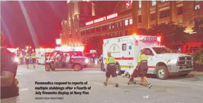  ?? NADER ISSA/SUN-TIMES ?? Paramedics respond to reports of multiple stabbings after a Fourth of July fireworks display at Navy Pier.