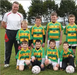  ??  ?? Boherbue U10 football team pictured with John Hartnett and Richard Enright in 2012. Photo by Sheila Fitzgerald
