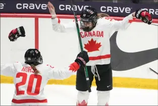 ?? THE CANADIAN PRESS CHRISTINNE MUSCHI ?? Canada’s Danielle Serdachny celebrates her overtime goal with teammate Sarah Nurse in their gold medal game against the United States at the IIHF Women’s World Hockey Championsh­ip in Utica, N.Y., Sunday.