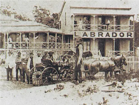  ?? ?? Some of Labrador’s earliest residents pictured outside the Labrador Hotel on Marine Parade in 1884. It lasted three years. Picture: Gold Coast City Council.