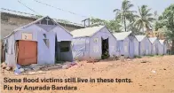  ??  ?? Some flood victims still live in these tents. Pix by Anurada Bandara