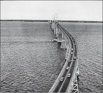  ?? PHOTO COURTESY OF THE MARYLAND DEPARTMENT OF TRANSPORTA­TION ?? The original bridge across the Chesapeake Bay opened in 1952 at a cost of $45 million from Sandy Point to Kent Island. It is today’s eastbound span. In the early 1960s, there were proposals for three more bridges across the bay, including one from...